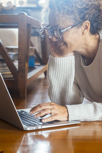 Man using laptop at table