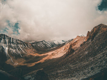 Panoramic view of snowcapped mountains against sky