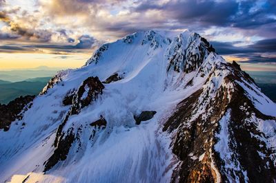 Scenic view of snowcapped mt hood against sky during sunset