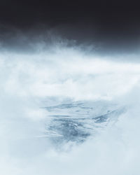 Scenic view of snow covered mountain against sky