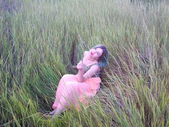 Woman with pink petals on field