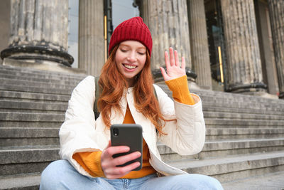 Young woman using mobile phone