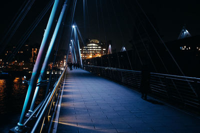 Illuminated suspension bridge at night