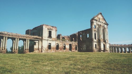 Low angle view of old building against clear sky