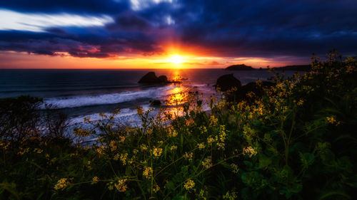 Scenic view of sea against sky during sunset