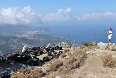 Panoramic view of sea and buildings against sky