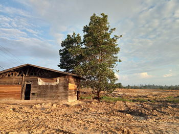 House on field against sky