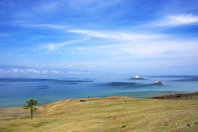 Distant view of olkhon island against blue sky