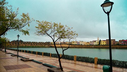 Street by swimming pool against sky