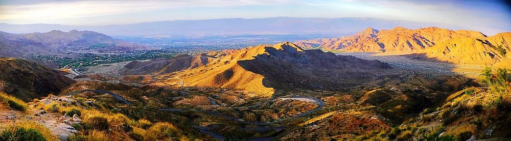 Aerial view of landscape against cloudy sky