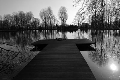 Pier over lake against sky