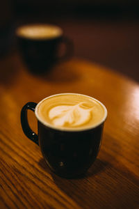 Close-up of cappuccino on table