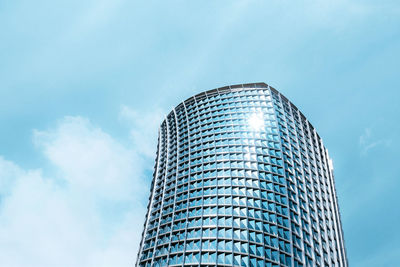 Low angle view of modern office building against sky