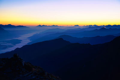 Scenic view of mountains against sky during sunset