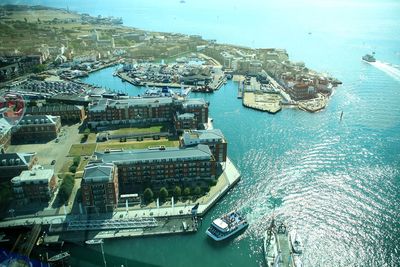 High angle view of cityscape by sea