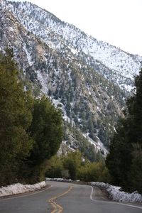 Scenic view of trees and mountains against sky