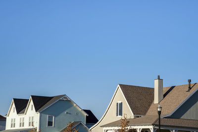 Low angle view of buildings against blue sky