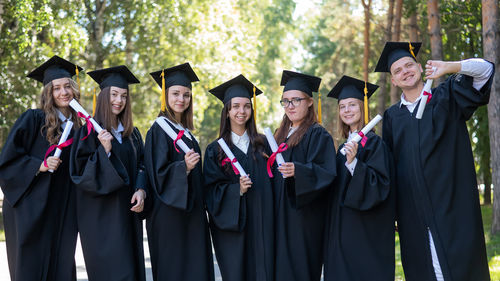 Rear view of woman wearing graduation gown