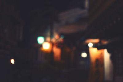 Defocused image of illuminated city at night