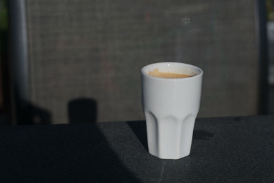 Close-up of coffee cup on table