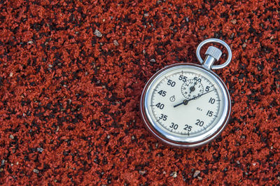 Close-up of stopwatch on field