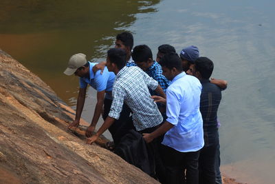 Friends standing in water