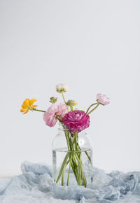 Close-up of flower vase against white background