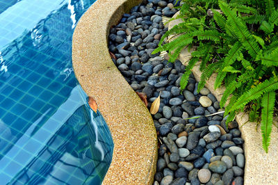 High angle view of stones by swimming pool