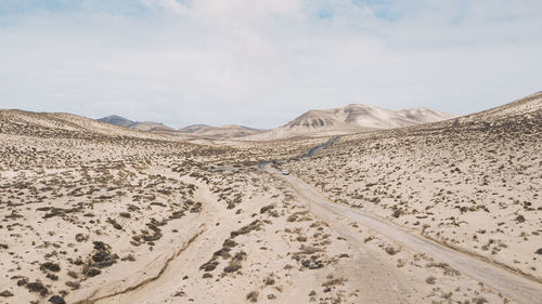 Scenic view of desert against sky