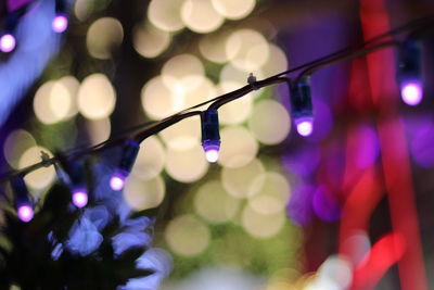 Close-up of illuminated colorful christmas lights at night