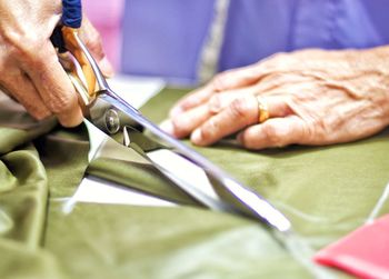 Close-up of man working on floor