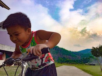 Boy playing against sky