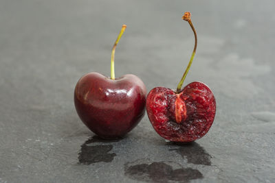 Close-up of cherries on wet table