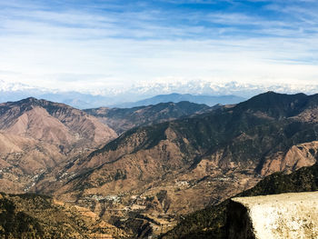 Scenic view of mountains against cloudy sky kanatal uttarakhand 