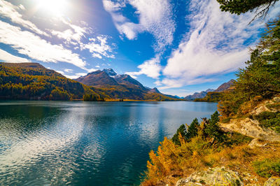 Lake sils maria, in the engadine, photographed in autumn, with landscape and mountains above it.