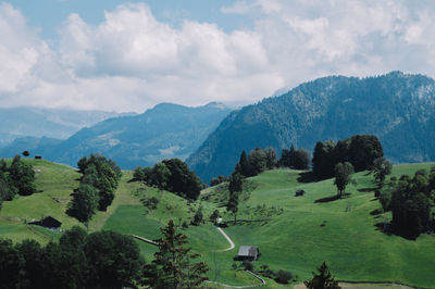 Scenic view of landscape and mountains against sky