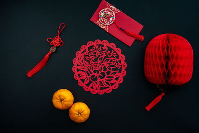 Chinese lunar new year decoration over black background. flat lay concept festive decoration. 