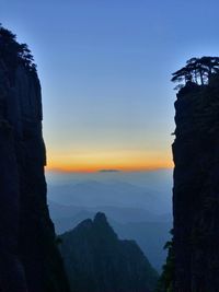 Scenic view of mountains against sky during sunset