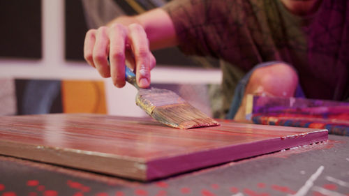 Close-up of woman hand on table