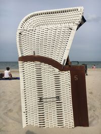 Man on beach against sky