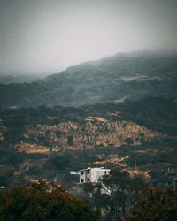 High angle view of trees and mountains against sky