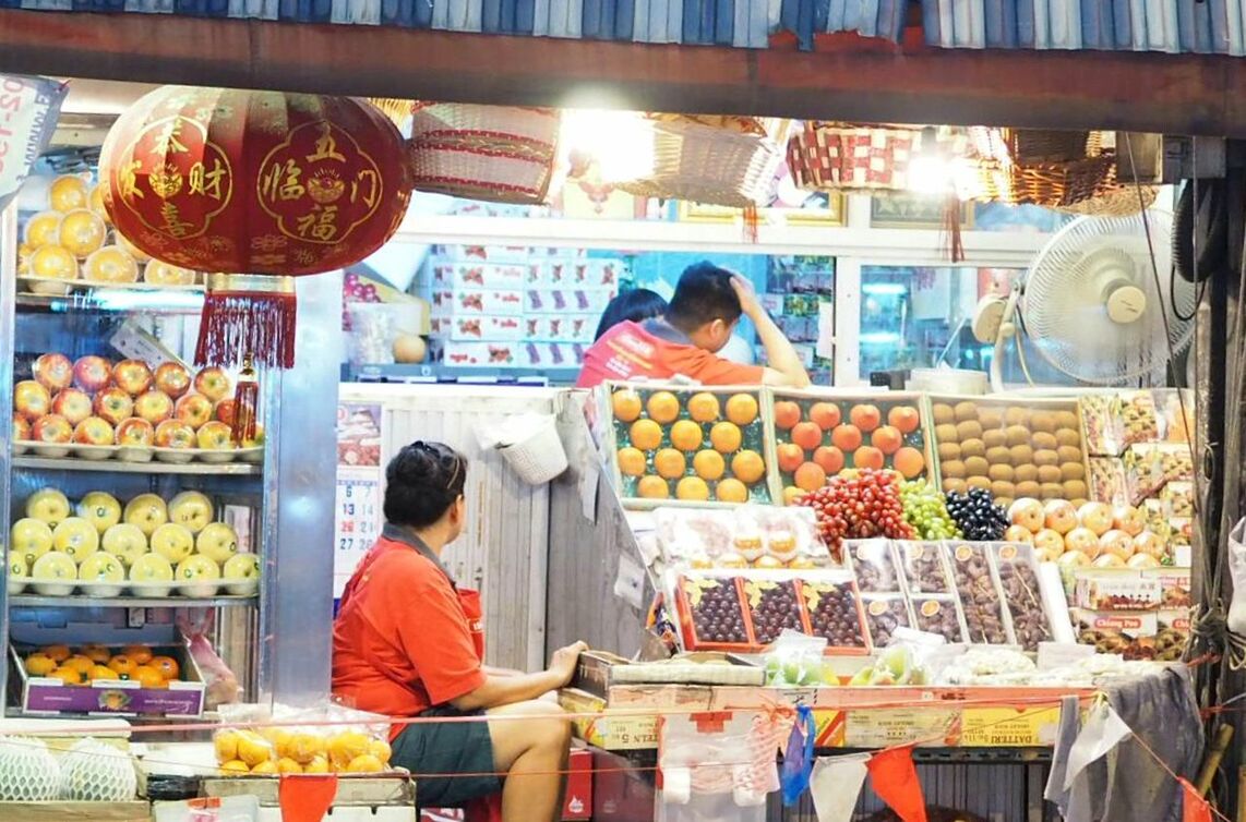 MAN WORKING IN MARKET