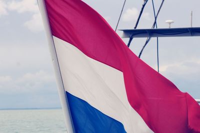 Low angle view of flag against sky