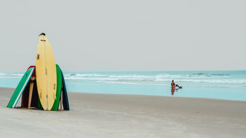 Scenic view of beach against clear sky