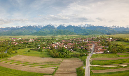 Scenic view of agricultural landscape against sky