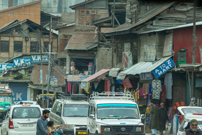 Vehicles on road along buildings