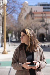 Young woman looking at city