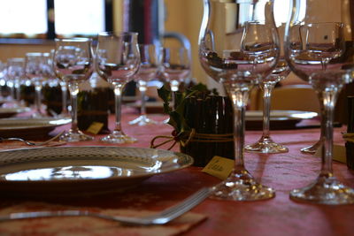 Close-up of wine glasses on table