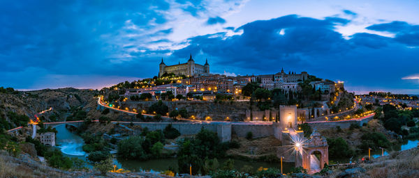 Illuminated buildings in city at night