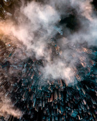 High angle view of crowd on illuminated city buildings